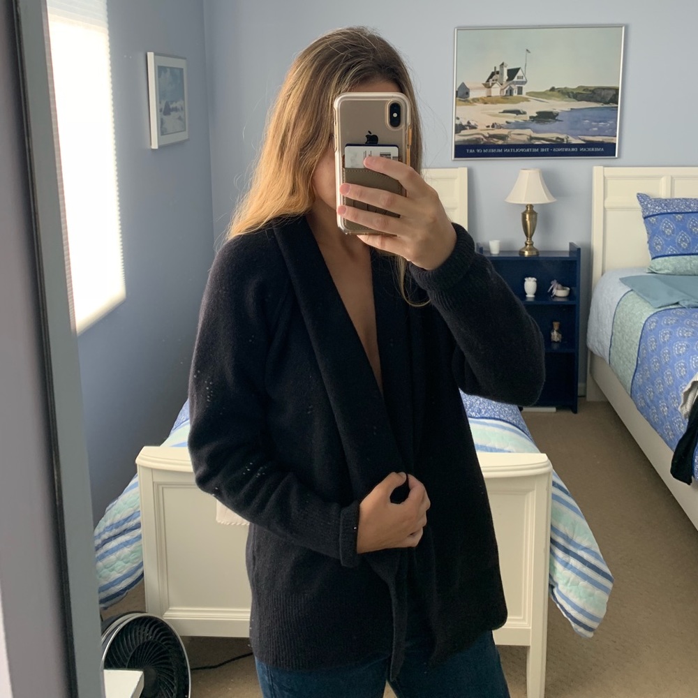 James Peres black open sweater.